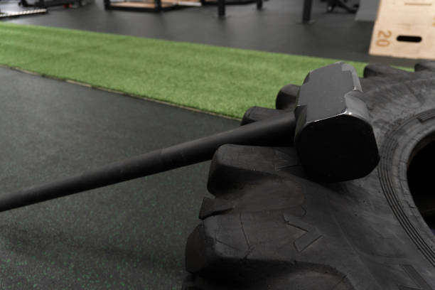 istock Sledgehammer training wheel active physical, for sportswear tire for athletic for bodybuilding concentration, exercise muscle. Dark biceps effort 1388694923