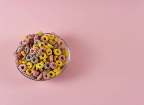 istock multicolored flakes rings in a plate on a pink background close-up 1388695518