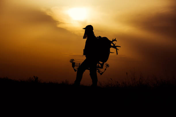 istock Silhouette of a bow hunter 1388698495