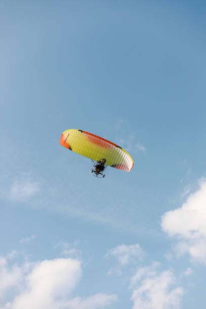 istock A person paragliding in a sky on a clear day 1388699748