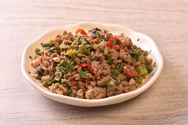 istock Sauteed minced pork with chive flowers in salted black bean 1388704749