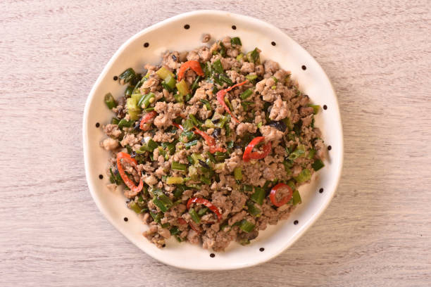 istock Sauteed minced pork with chive flowers in salted black bean 1388705297