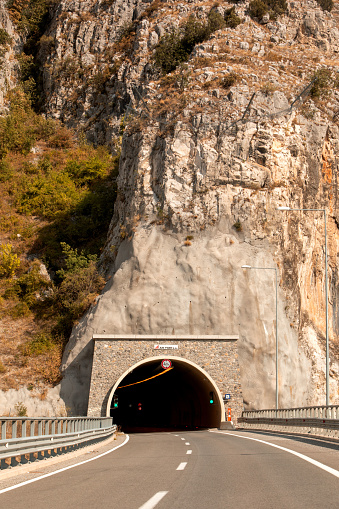 tunnel road in greece mountains copy space