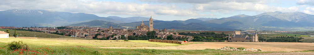 Panoramic view of the town from northern approach, mountains of the Sierra de Guadarrama in the background, Segovia, Spain