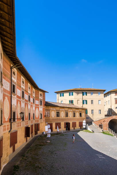 Tourist visiting Piazza della Repubblica in San Miniato, where overlooks the eighteenth-century episcopal seminary with frescoed facade