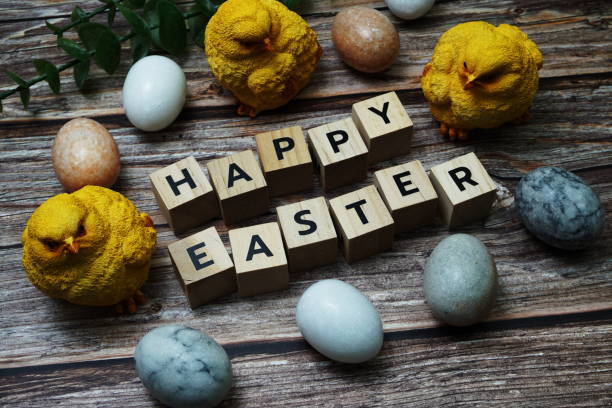 istock Happy Easter and easter eggs decoration on wooden background 1388708966