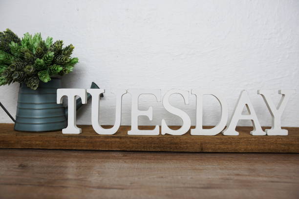 istock Tuesday alphabet letters on wooden background 1388709857