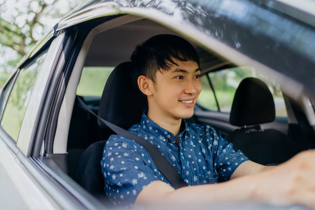 istock Young asian man driving a car 1388710272