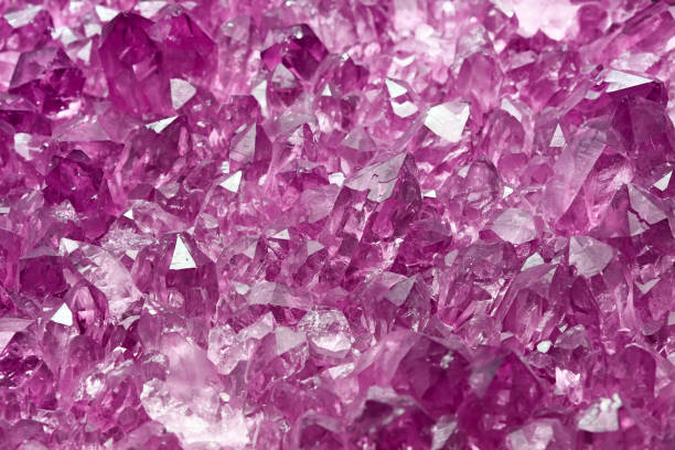 istock Cluster of purple quartz mineral crystals 1388711021