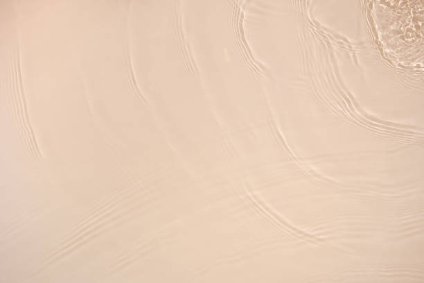 istock transparent beige colored clear calm water surface texture 1388712464