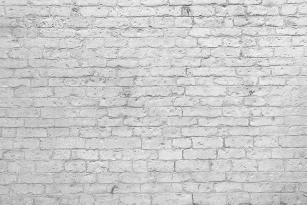 istock Grunge white painted brick wall background 1388713927