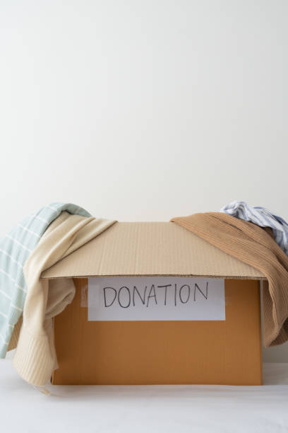istock Clothes on the donation box. Donation, Sharing, Volunteer concept 1388715976