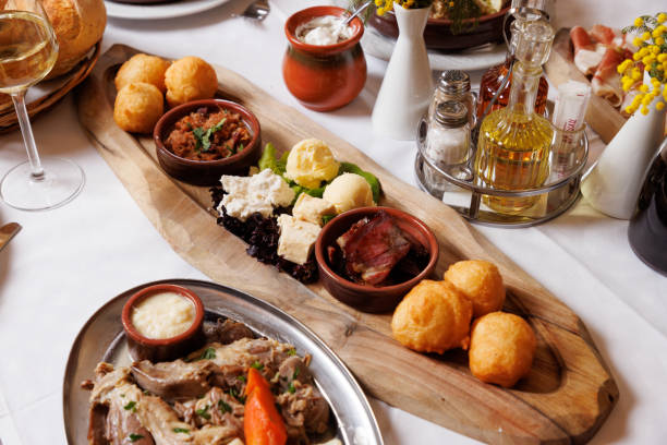 istock Appetizer serving on wooden tray on buffet in restaurant 1388719216