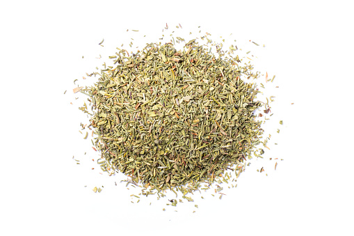 Pile of dried herbs isolated on white background. Top view. Flat lay.