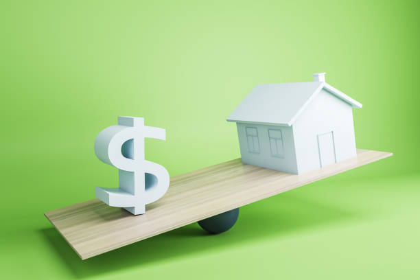 istock Board scales with dollar sign heavier than house. Green background. 3D Rendering. 1388720732