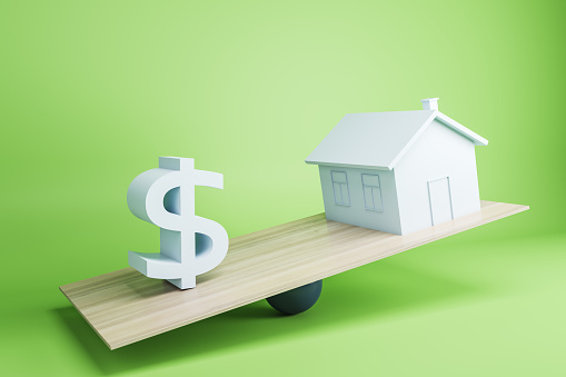 Board scales with dollar sign heavier than house. Green background. 3D Rendering