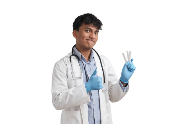 istock Young peruvian male doctor holding negative covid-19 antigen tests, isolated. 1388720930