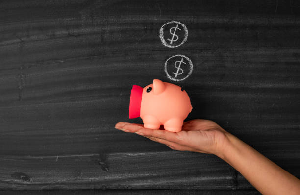 istock Saving money in piggybank 1388722615