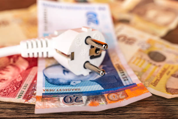 istock White electric plug on bulgarian currency 1388722701