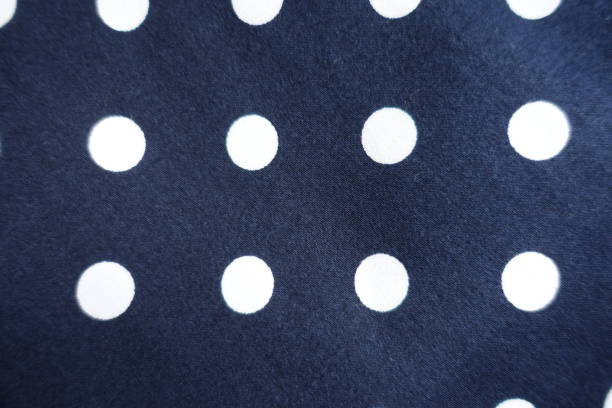 istock Swatch of dark blue cotton fabric with white polka dot pattern 1388723268