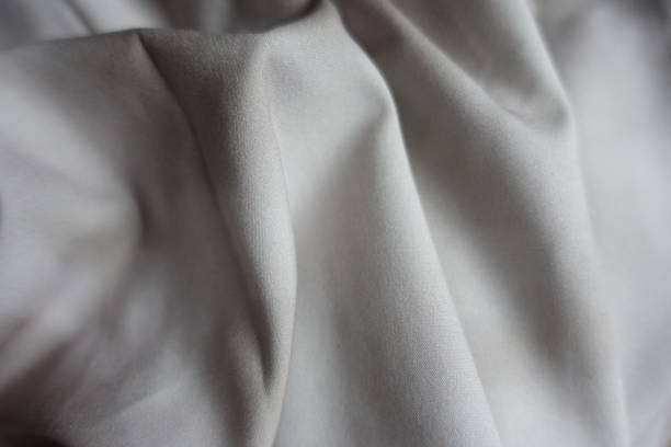istock Folds on viscose and polyester fabric with tie dye pattern in shades of gray 1388724097