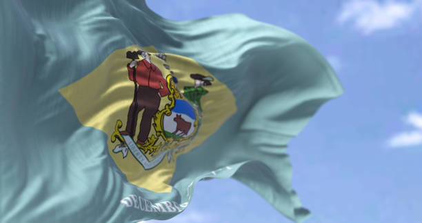 The state flag of Delaware waving in the wind The state flag of Delaware waving in the wind. Delaware is a state in the Mid-Atlantic region of the United States. Democracy and independence. US state. delaware us state photos stock pictures, royalty-free photos & images