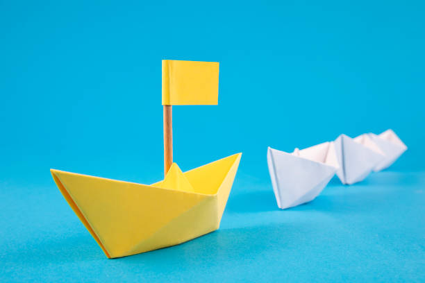 istock Leadership Concept with Paper Boats 1388726445