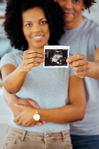 istock Cheerful couple holding an ultrasound 1388728049