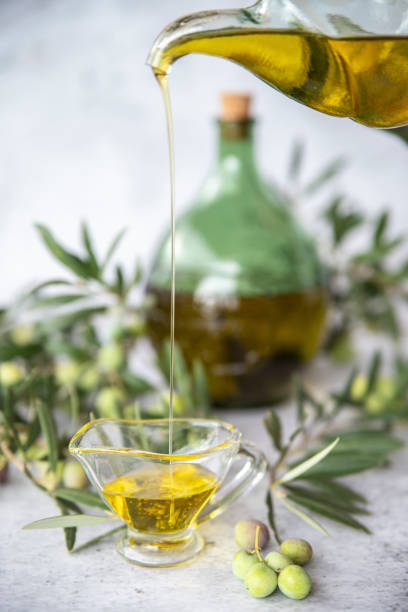 istock green olives with olive oil on a dark background 1388728209