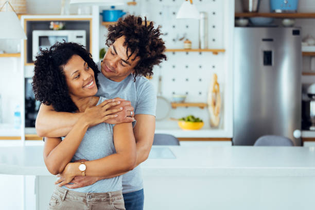 istock Young cheerful spouses enjoying morning time together 1388729069