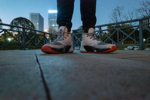 istock Feet on a concrete road at night 1388729338