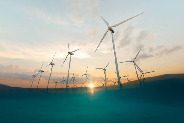 istock Wind power station and sea under sunset sky 1388732021