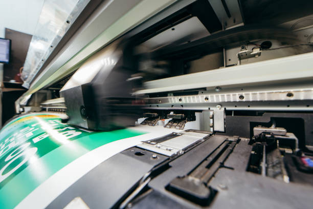 Graphic design and advertising concept. Large format plotter, close up Graphic design and advertising concept. Large format plotter, close up digital printing house stock pictures, royalty-free photos & images