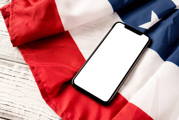istock Blank screen on modern smartphone for mockup design on USA national flag 1388734063