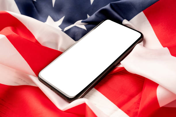 istock Blank screen on modern smartphone for mockup design on USA national flag 1388735225
