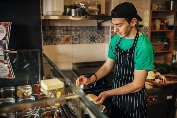 istock Chef preparing food in fast food 1388738964