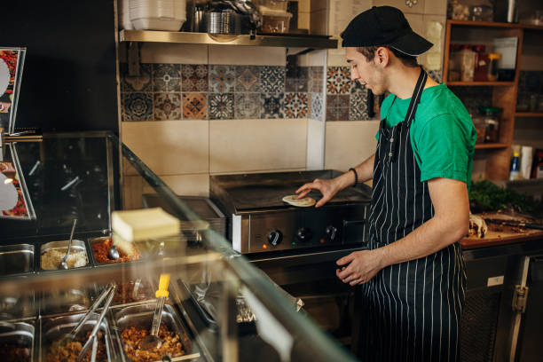 istock Chef preparing food in fast food 1388739064