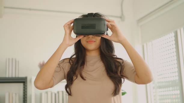istock Asian woman with vr glasses. 1388739229