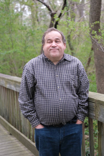 istock Disabled Autistic man posing for a portrait outdoors during the day. 1388742247