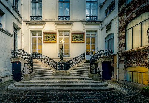 Paris, France - April 7, 2021: Beautiful staircase in a private courtyard in Paris