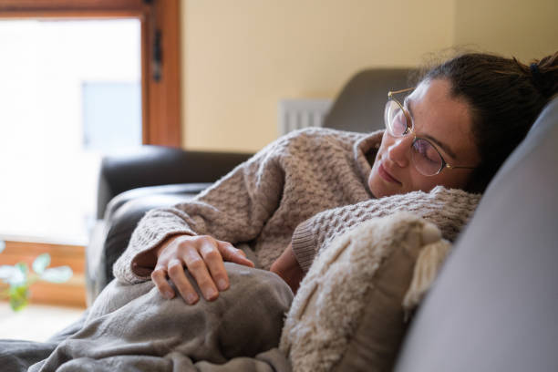 istock Young woman asleep on the couch. 1388745136