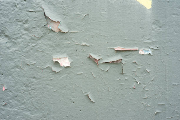old concrete gray wall with cracked paint