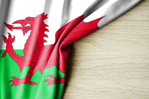 istock Wales flag. Fabric pattern flag of Wales. 3d illustration. with back space for text. 1388746724