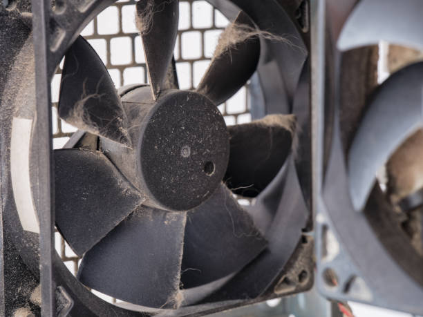 A dusty fan in a computer case A dusty fan in a computer case. Close up. computer case stock pictures, royalty-free photos & images