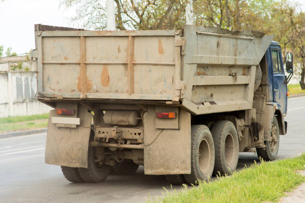 istock Cargo dump truck driving on the city highway 1388751424