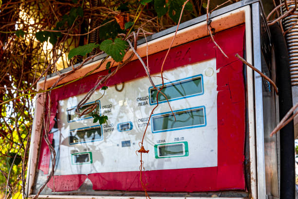 istock Old abandoned overgrown rusty gas station in Bulgaria. 1388752446