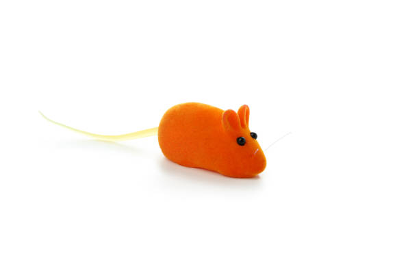 istock Orange toy mouse isolated on white background 1388753871