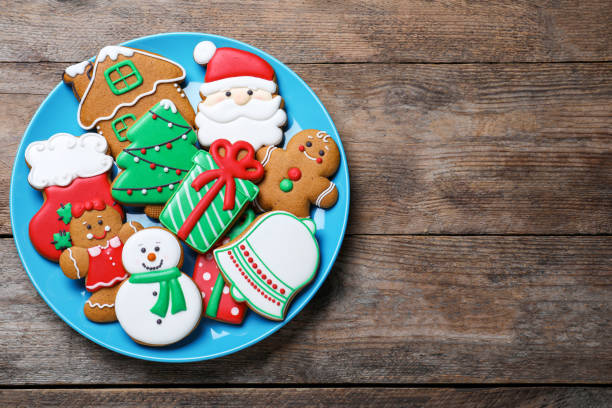 istock Delicious Christmas cookies on wooden table, top view. Space for text 1388754006