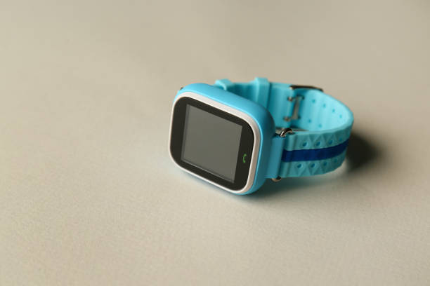 istock Modern trendy smart watch for kids on grey background 1388755525