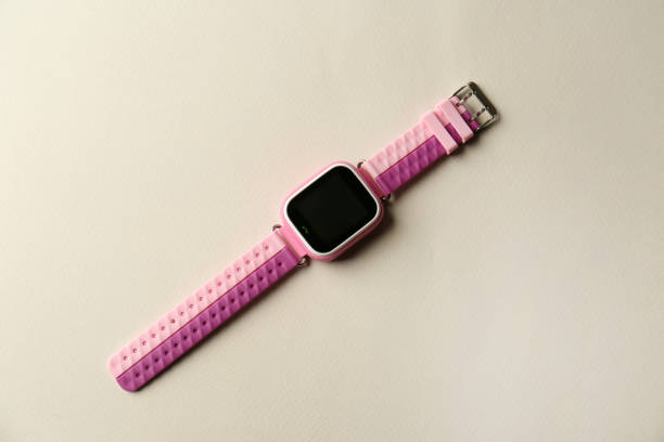 istock Trendy smart watch for kids on grey background, top view 1388755670